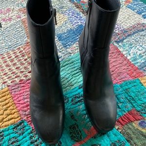 Black platform ankle boots by ASH